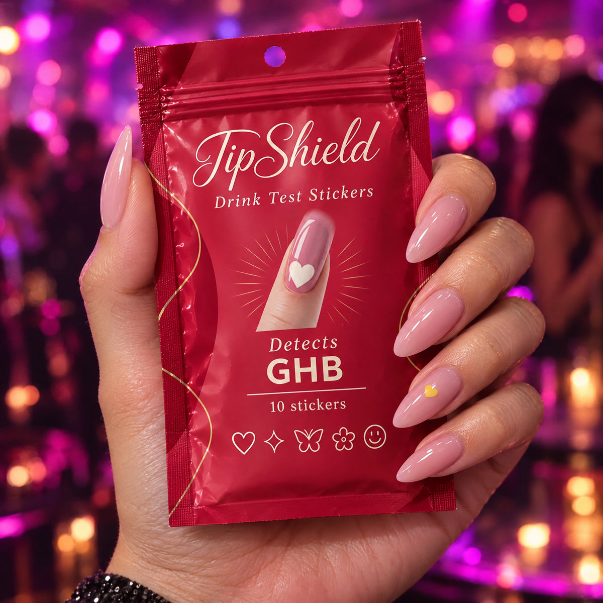 Hand holding the TipShield pouch on a night out